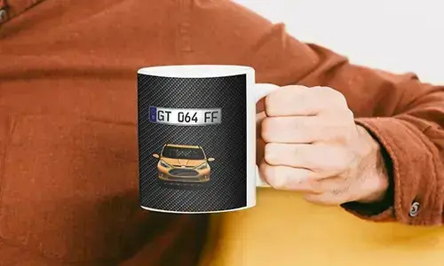 car mug in man's hand