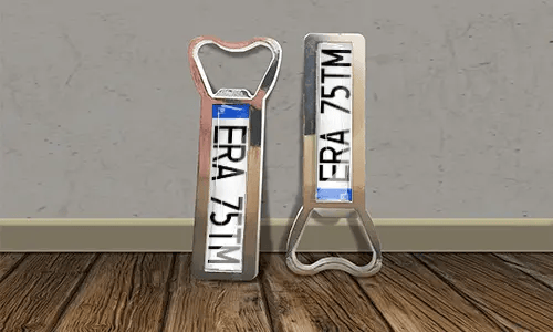 two bottle opener magnets on the floor