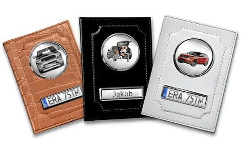 Three personalized car document holders with custom designs