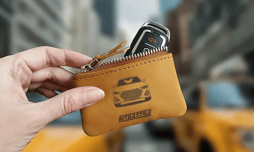 Brown zippered pouch with printed truck front and plate 