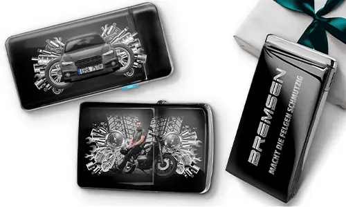 Sleek gift boxes featuring a blue car and a biker surrounded by metallic gears. One box reads 